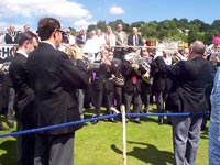 Playing Gresford.  Tony Benn looks on. 