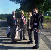 John and the Trombone section pose before setting off for a long day!